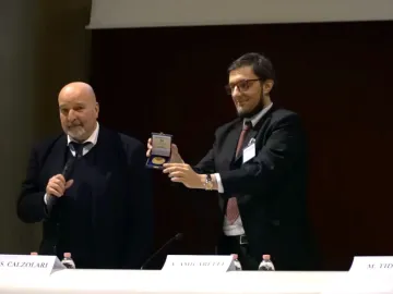 Calzolari and Amicarelli show the medal
