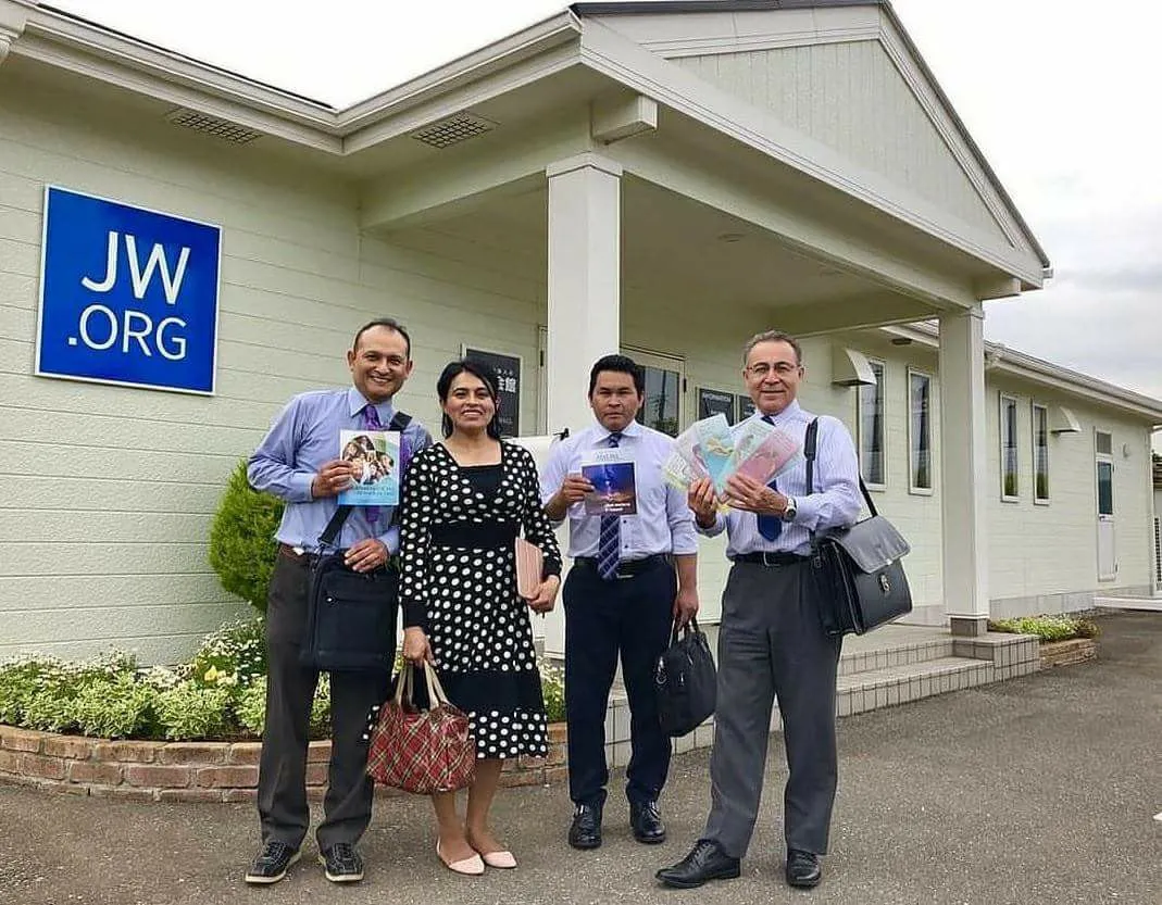 Jehova's Withnesses in front of a house of worship in Japan